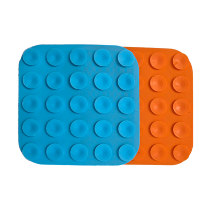 Back view of Zakity lick mats showing blue and orange silicone suction cups for wall and floor mounting