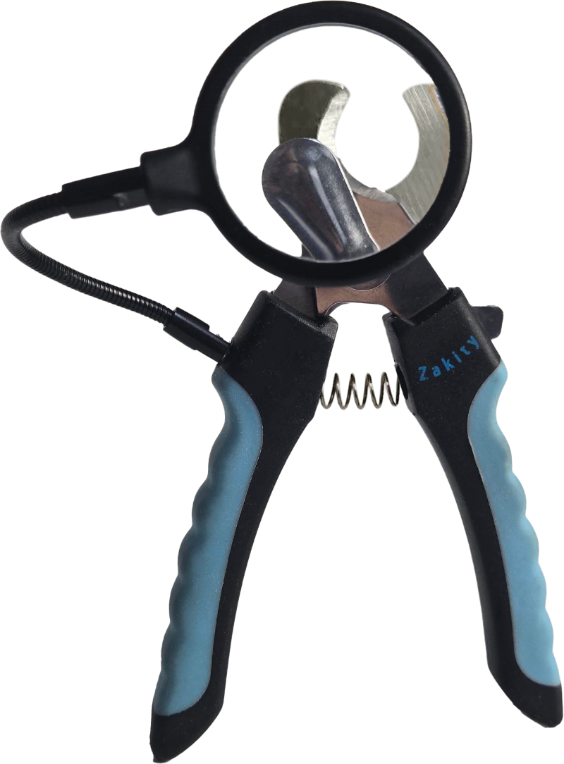 Zakity dog nail clipper with 3x magnifier lens showing magnified view of stainless steel blades